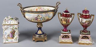 Pair of Dresden porcelain urns on plinths, togethe