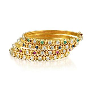 A Set of Four Diamond and Gemstone Bangle Bracelets