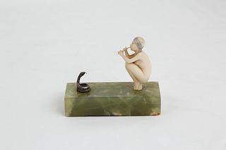 F. Preiss carving of a Snake Charmer on a green onyx base.