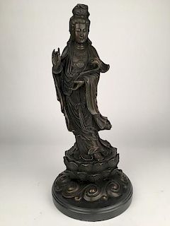 Bronze Oriental Goddess mounted on a dark brown marble base.