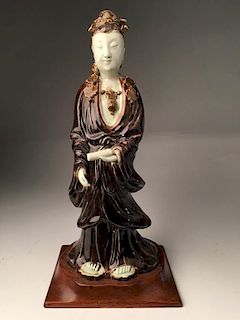 Chinese white and iron glazed figure of a Quan Yin.