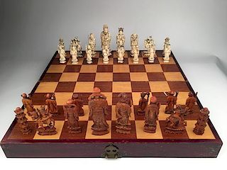 Thirty two piece carved  chess set with seperated lined dividers.<BR>Largest