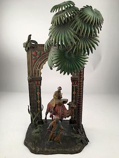 Antique Vienna bronze Orientalist bronze lamp with one man ridding a camel playi