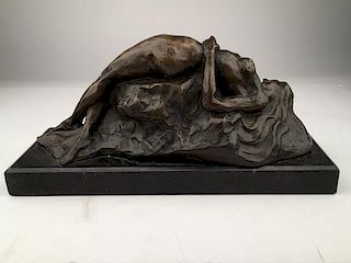 Bronze reclining nude mounted on a black marble base.<BR>Height 6 1/4 inches.