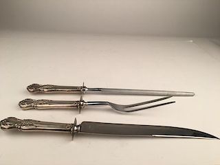 Three piece carving set with sterling silver handles.