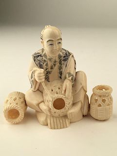 Carved Okimono figure seated and making baskets.<BR>SIgned on the bottom.<BR>Height