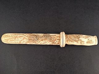 Carved letter opener with sheath.