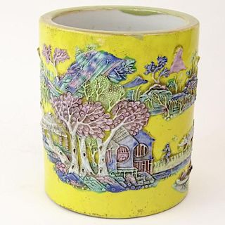 Chinese Guangxu (1875-1908) Famille Jaune Porcelain Brush Pot with Molded Relief Decoration Depicting a Mountain Village Land