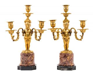 A Pair of Continental Gilt Bronze Three-Light Figural Candelabra Height 15 inches.