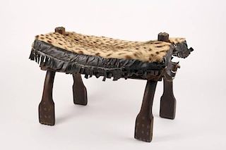 Camel Saddle Coverted to Footstool w/ Cheetah Hide