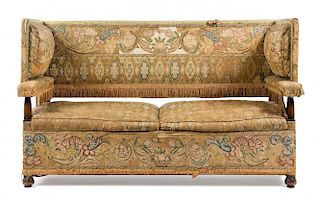 A Needlepoint Upholstered Knole Sofa Height 41 1/4 x width 68 1/2 x depth 28 inches.