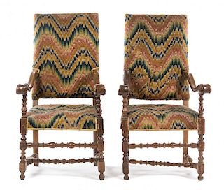 A Pair of Italian Baroque Walnut Armchairs Height 51 inches.