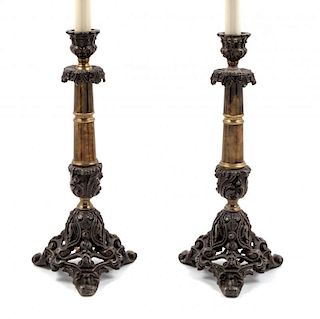 A Pair of Neoclassical Style Cast Metal Candlesticks Height overall 24 inches.