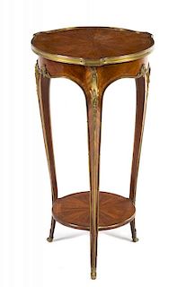 A Louis XV Style Gilt Bronze Mounted Kingwood Table Height 30 x diameter of top 16 inches.