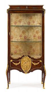 A Transitional Style Gilt Bronze Mounted Kingwood Vitrine Cabinet Height 69 1/2 x width 33 1/2 x depth 16 inches.
