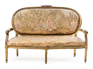 A Louis XVI Style Giltwood Settee Height 41 3/8 x width 61 x depth 22 inches.