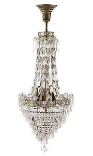 An Empire Style Four-Light Chandelier Height 38 inches.