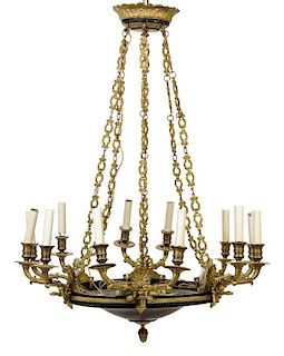 An Empire Style Gilt Bronze and Tole Twelve-Light Chandelier Diameter 25 inches.