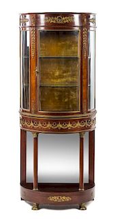 An Empire Style Gilt Bronze Mounted Mahogany Vitrine Cabinet Height 65 1/2 x width 27 1/4 x depth 15 3/4 inches.