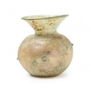 A Roman Blown Glass Jar Height 4 5/8 inches.