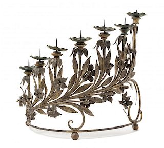 An Italian Rococo Wrought Iron Seven-Light Candelabrum Height 16 x width 16 5/8 inches.