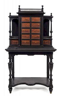 An Italian Ebonized Cabinet on Stand Height 62 x width 35 x depth 16 inches.