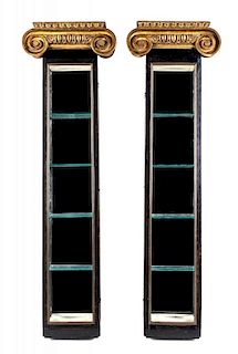 A Pair of Neoclassical Style Gilt and Ebonized Hanging Vitrines Height 39 1/2 x width 12 x depth 4 1/2 inches.