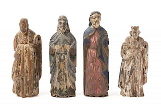 Four Carved and Polychrome Decorated Santos Figures Height of tallest 12 1/4 inches.