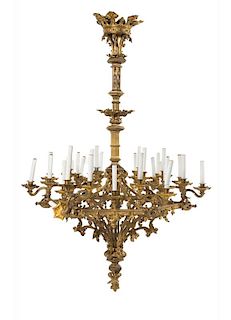 A Gothic Revival Gilt Bronze Thirty-Light Chandelier Height 60 x diameter 39 inches.
