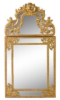 A Continental Giltwood Mirror Height 56 x width 30 inches.