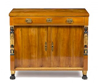 An Austrian Empire Parcel Gilt and Ebonized Birch Cabinet Height 34 1/4 inches.