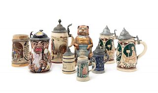 A Collection of German Ceramic Beer Steins Height of tallest 9 1/4 inches.