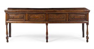 A Jacobean Carved Oak Sideboard Height 33 7/8 x width 88 1/2 x depth 18 1/8 inches.