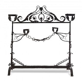 An English Wrought Iron Fireplace Screen Height 49 5/8 x width 49 3/4 inches.