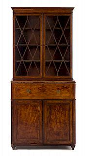 A Regency Mahogany and Satinwood Secretary Bookcase Height 81 x width 36 x depth 19 5/8 inches.