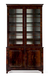 A Regency Style Rosewood Bookcase Height 95 1/4 x width 51 x depth 19 3/8 inches.