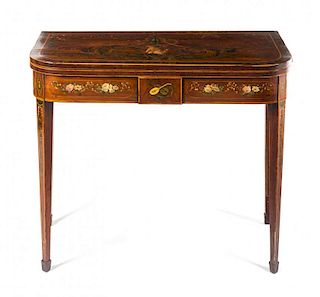 A Sheraton Style Painted Mahogany Flip-Top Table Height 28 3/4 x width 35 1/2 x depth 17 1/4 inches.