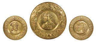 Three English Brass Chargers Diameter of largest 37 1/2 inches.