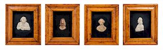 A Group of Four English Wax Busts Height 8 x width 6 5/8 inches (framed).