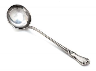 A Victorian Pewter Soup Ladle, Circa 1850, the handle worked to show a shell motif with foliate scroll borders.