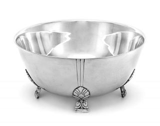 An American Silver Center Bowl, Tiffany & Co., New York, NY, raised on feet worked to show acanthus leaves and swags.