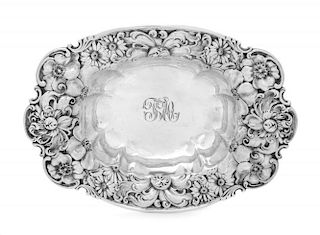 An American Silver Bowl, Whiting Mfg. Co., New York, NY, of oval form, the border having repousse floral decoration.