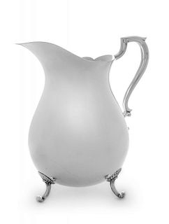 An American Silver Water Pitcher, Poole Silver Co., Taunton, MA, having a baluster form body, raised on scroll feet.