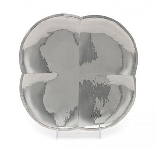 A German Silver Tray, Maker's Mark Schafer, 20th Century, of quatrefoil form with spot-hammered decoration, raised on flatten