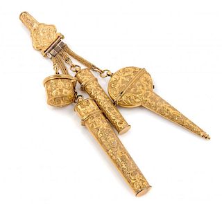 A Continental Gilt Metal Chatelaine Height overall 6 3/4 inches.