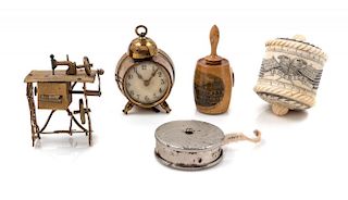 A Collection of Victorian Tape Measures Diameter of largest 1 5/8 inches.