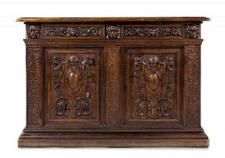 A Renaissance Revival Walnut Cabinet Height 48 x width 71 x depth 24 3/4 inches.