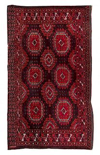 A Tekke Chuval Wool and Cotton Rug 6 feet 2 inches x 3 feet 2 inches.