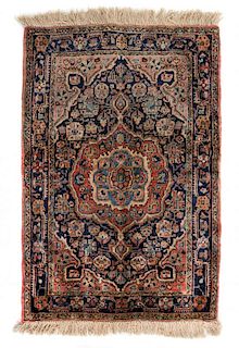 A Sarouk Wool Rug 2 feet 9 1/2 inches x 1 foot 11 3/4 inches.