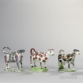 Three Staffordshire Pottery Cow Creamers
